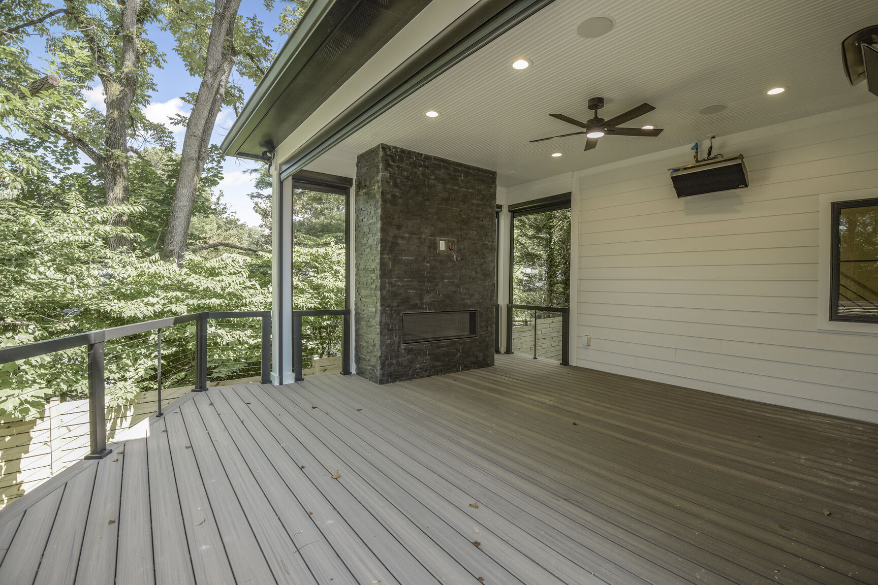 Covered porch with fireplace