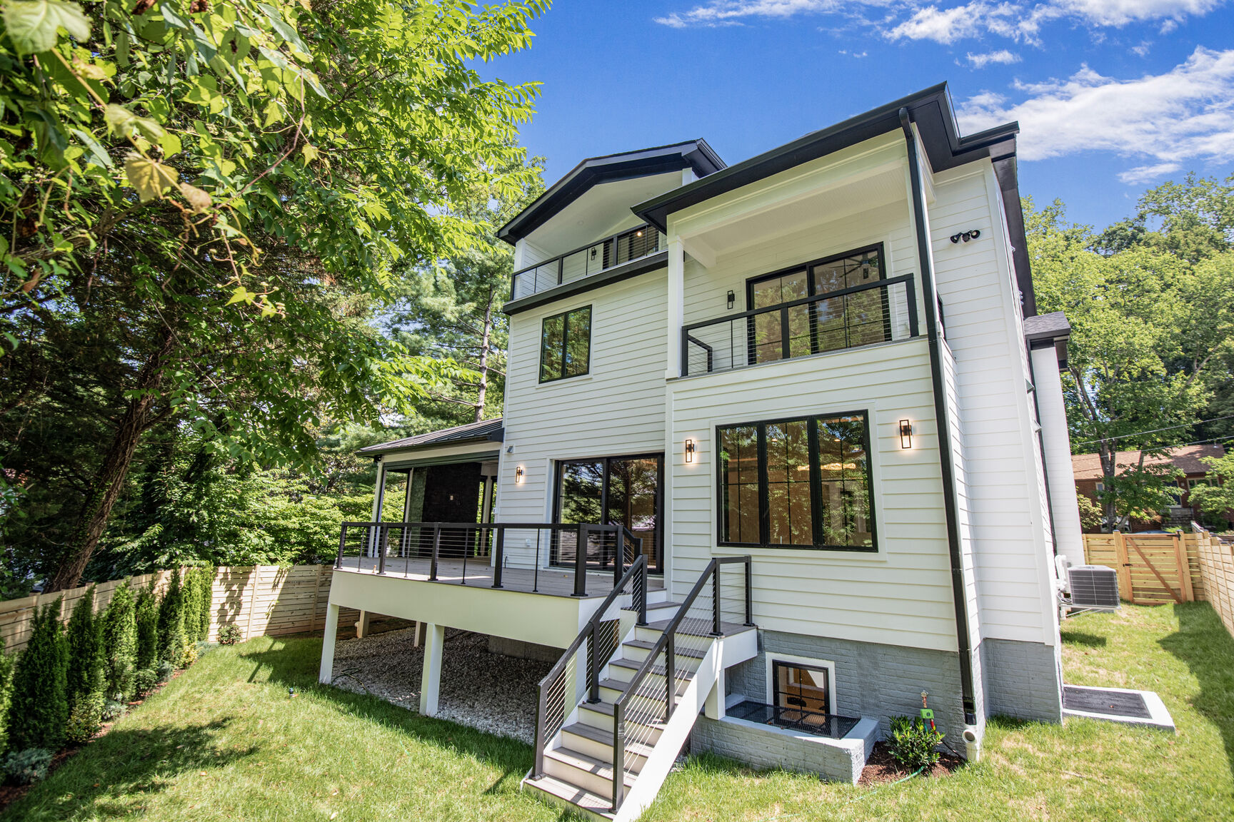 Rear exterior with deck and cable railing